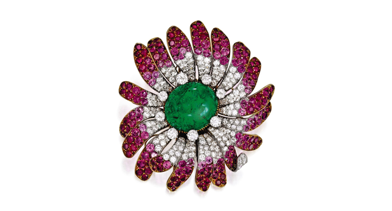 A floral Bulgari brooch with one oval-shaped cabochon emerald at center, the petals set with round and single-cut rubies and pink sapphires and diamond accents, sold for $187,500. A floral Bulgari brooch with one oval-shaped cabochon emerald at center, the petals set with round and single-cut rubies and pink sapphires and diamond accents, sold for $187,500.