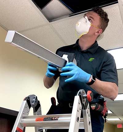 An EMT employee installing the microbial technology system in James Free Jewelers’ store An EMT employee installing the microbial technology system in James Free Jewelers’ store