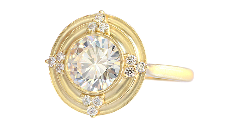 The “Thea” halo engagement ring with 0.15 carats of single-cut diamond trios, the signature soft finish and milgrain detail in 18-karat gold (setting starts at $4,400). The “Thea” halo engagement ring with 0.15 carats of single-cut diamond trios, the signature soft finish and milgrain detail in 18-karat gold (setting starts at $4,400).