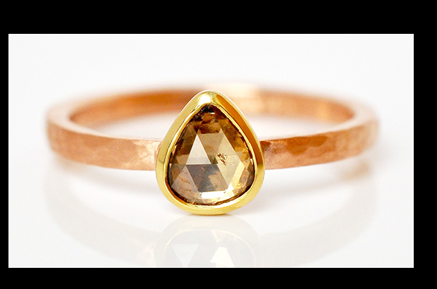 Hand-fabricated engagement ring by Emily Johnson in hammered 14-karat red gold with an 18-karat yellow gold bezel and a 0.25-carat pear-shaped champagne rose-cut diamond ($1,475) <a target="_blank" href="http://www.ecdesignstudios.com/"><span style="color: #ff0000;">ECDesignStudios.com</span></a>