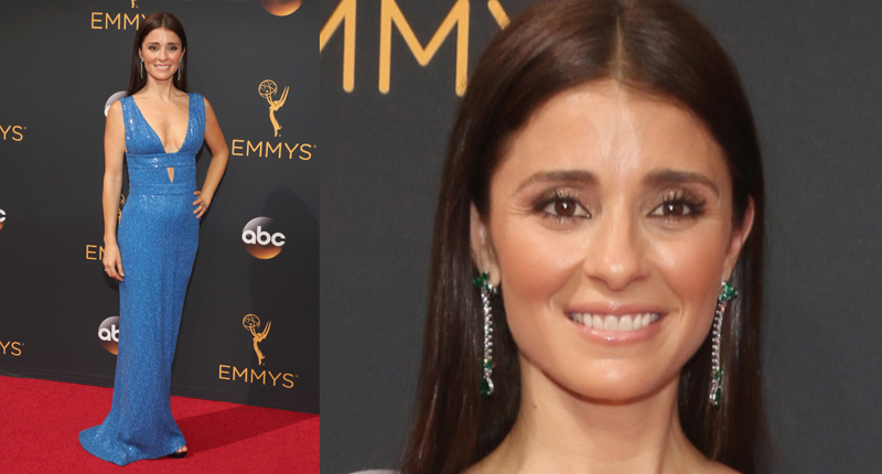 Shiri Appleby in emerald and diamond drop earrings and a diamond ring by Piaget