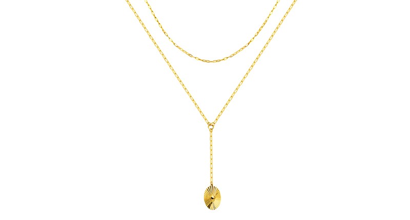 <p><a href="https://www.midaschain.com" target="_blank" rel="noopener">Midas Chain</a> 14-karat yellow gold lariat necklace with a fluted medallion on a paper clip chain ($1,560) </p>