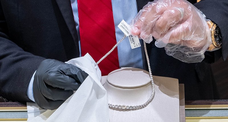 Cleaning jewelry before and after every customer try-on has become the norm for jewelry retailers. Here, an employee at a Jared the Galleria of Jewelry store wipes down a diamond necklace. Cleaning jewelry before and after every customer try-on has become the norm for jewelry retailers. Here, an employee at a Jared the Galleria of Jewelry store wipes down a diamond necklace.