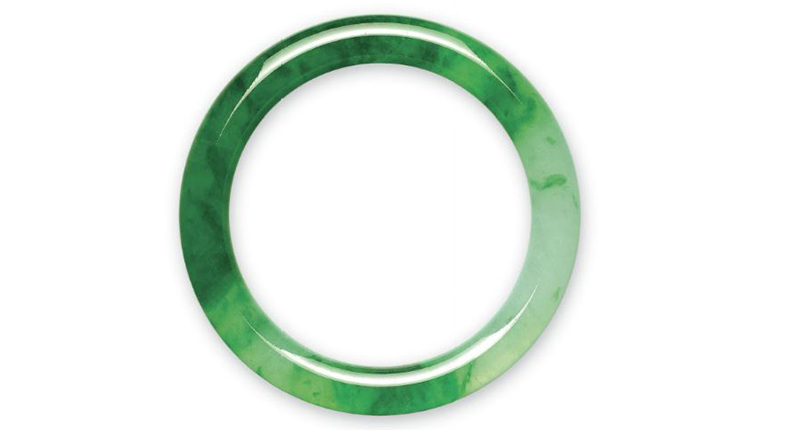 This cylindrical jadeite bangle with a width of approximately 9 mm and thickness of approximately 8.8 mm went for $2 million to a private buyer.