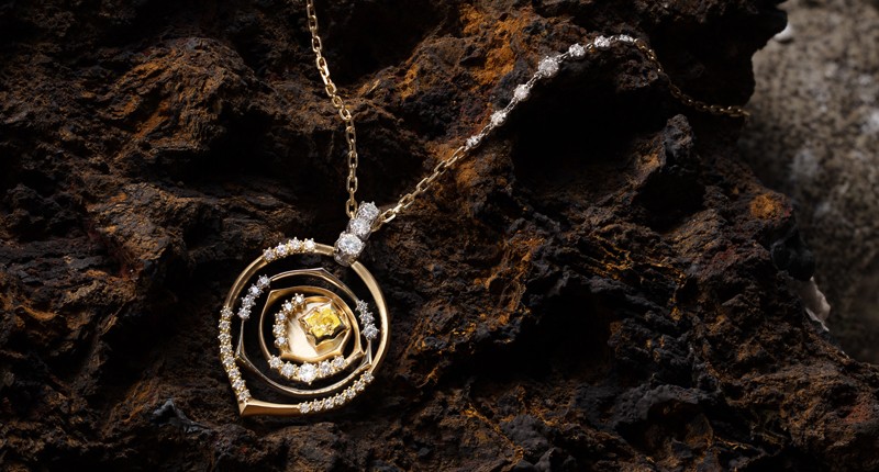 A close-up of the Jade Trau pendant, inspired by a De Beers diamond mine in Botswana. A close-up of the Jade Trau pendant, inspired by a De Beers diamond mine in Botswana.