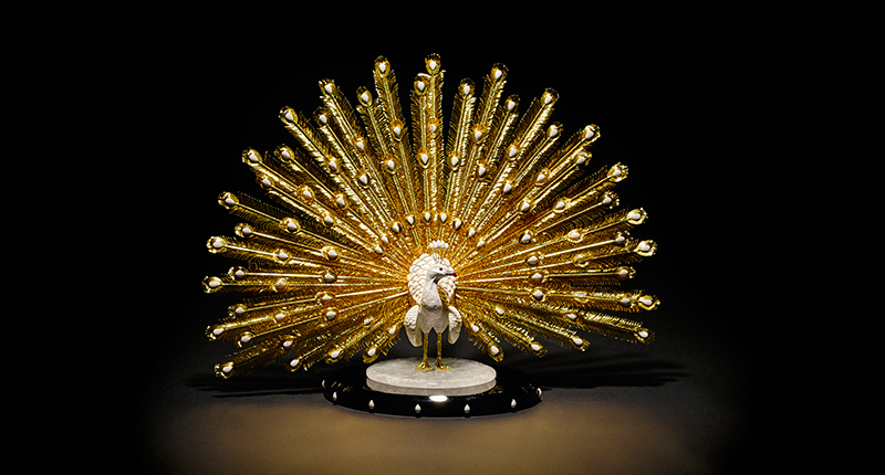 This piece from Luis Alberto Quispe Aparicio is made from white kascholong opal from Siberia, which has a porcelain appearance without a play of color, with the feathers and feet of the peacock rendered in gold vermeil. It could sell for up to $60,000. This piece from Luis Alberto Quispe Aparicio is made from white kascholong opal from Siberia, which has a porcelain appearance without a play of color, with the feathers and feet of the peacock rendered in gold vermeil. It could sell for up to $60,000.