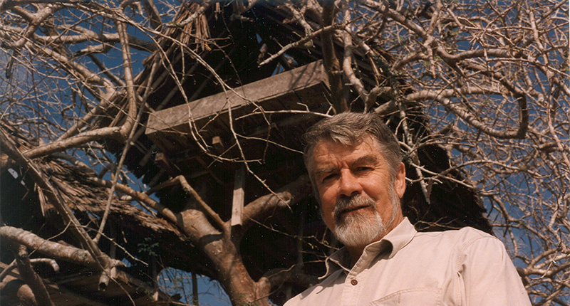 The late Campbell Bridges is seen here in front of the original tree house at the Scorpion tsavorite mine, which he used to watch over his site.