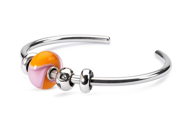 Trollbeads’ “Orange You Happy” bangle is made in sterling silver with the “Heart Print” bead, two silver stoppers and the pink and orange armadillo glass bead. Fifteen percent of all online net product sales of this piece support <a href="http://www.erasems.org/" target="_blank"><span style="color: rgb(255, 0, 0);">Race to Erase MS</span></a> ($179). <a href="http://www.trollbeads.com/united-states/en-us" target="_blank"><span style="color: rgb(255, 0, 0);">trollbeads.com</span></a> Trollbeads’ “Orange You Happy” bangle is made in sterling silver with the “Heart Print” bead, two silver stoppers and the pink and orange armadillo glass bead. Fifteen percent of all online net product sales of this piece support <a href="http://www.erasems.org/" target="_blank"><span style="color: rgb(255, 0, 0);">Race to Erase MS</span></a> ($179). <a href="http://www.trollbeads.com/united-states/en-us" target="_blank"><span style="color: rgb(255, 0, 0);">trollbeads.com</span></a>