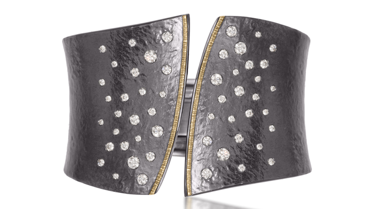 Elizabeth Garvin Fine Jewelry’s oxidized sterling silver hinged cuff with 18-karat gold and diamonds
