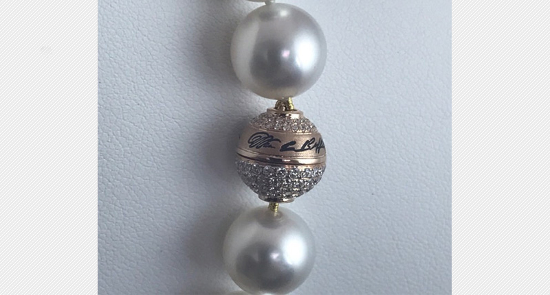 Pearls of … Warren? Borsheims moves a lot of merchandise bearing Buffett’s signature during shareholders weekend, including strands of freshwater pearls with his script on the clasp. Pearls of … Warren? Borsheims moves a lot of merchandise bearing Buffett’s signature during shareholders weekend, including strands of freshwater pearls with his script on the clasp.