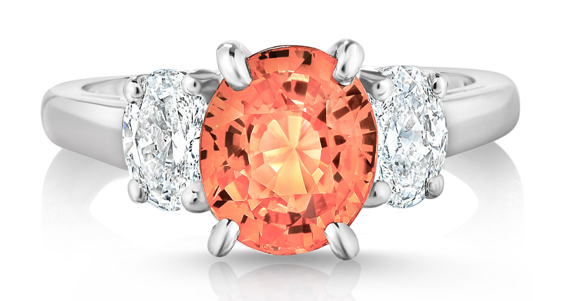 Pictured here is Oscar Heyman’s 2.59-carat padparadscha sapphire ring with two oval diamonds totaling 0.78 carats, set in platinum Pictured here is Oscar Heyman’s 2.59-carat padparadscha sapphire ring with two oval diamonds totaling 0.78 carats, set in platinum
