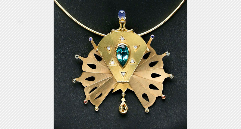 2016 Gold/Platinum Category Second Place Winner: “Peacock Pin” by Samantha Freeman. 2016 Gold/Platinum Category Second Place Winner: “Peacock Pin” by Samantha Freeman.