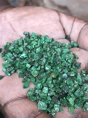 Tsavorite garnet rough from the Precious Women Mine in Mkuki, KenyaOkeno was a close friend and business colleague of gemstone faceter Roger Dery and his family. Tsavorite garnet rough from the Precious Women Mine in Mkuki, KenyaOkeno was a close friend and business colleague of gemstone faceter Roger Dery and his family.