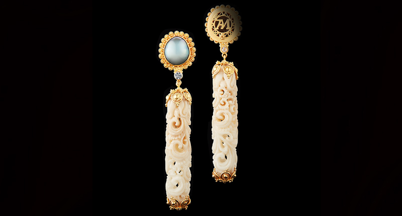 These earrings feature long carved tagua seeds and baroque pearls in 22-karat gold.