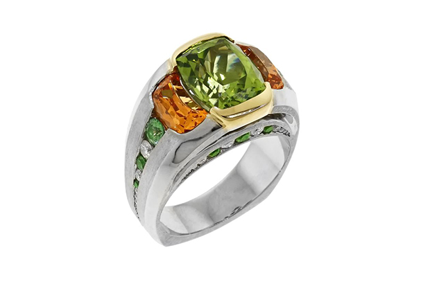 This platinum and 18-karat yellow gold ring from Mark Schneider won first place in Men’s Wear. The piece features peridot and a pair of spessartite garnets accented with tsavorite garnets, diamonds and a yellow diamond (not seen). This platinum and 18-karat yellow gold ring from Mark Schneider won first place in Men’s Wear. The piece features peridot and a pair of spessartite garnets accented with tsavorite garnets, diamonds and a yellow diamond (not seen).