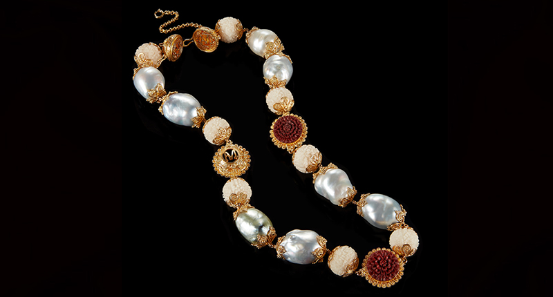 Another necklace from the collection, featuring tagua seeds, baroque pearls and 22-karat gold beads with carved red wood lotus flowers