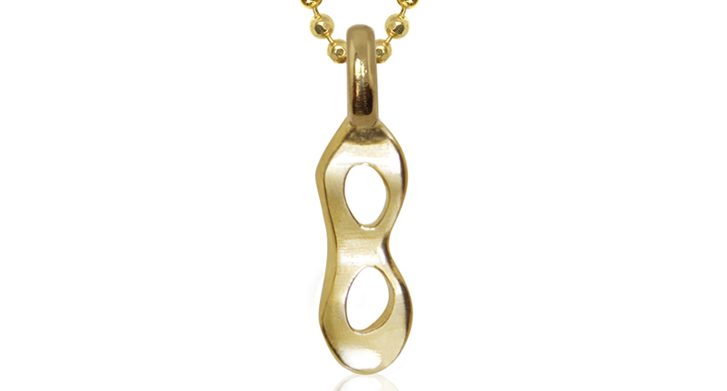 The mask design in 14-karat yellow gold The mask design in 14-karat yellow gold