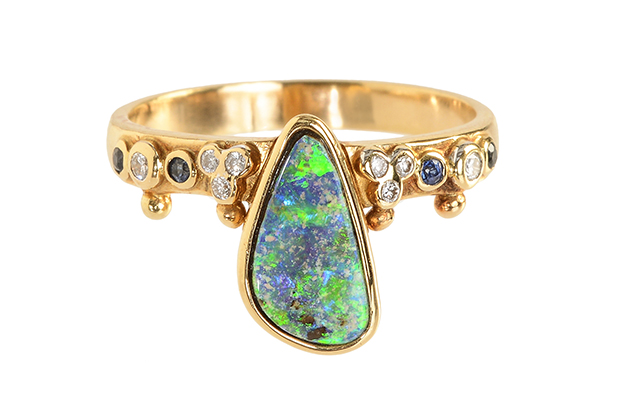 The First Knight ring has a boulder opal center stone accented with emeralds, blue sapphires and diamonds in 18-karat gold ($3,075). The First Knight ring has a boulder opal center stone accented with emeralds, blue sapphires and diamonds in 18-karat gold ($3,075).