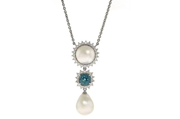 The first place honors in the Classical category went to this necklace from Brent Malgarin of Elegant Gems, Ltd. The platinum necklace features a 12.53mm natural pearl, 15.22mm natural pearl, and a blue zircon accented with diamonds. The first place honors in the Classical category went to this necklace from Brent Malgarin of Elegant Gems, Ltd. The platinum necklace features a 12.53mm natural pearl, 15.22mm natural pearl, and a blue zircon accented with diamonds.