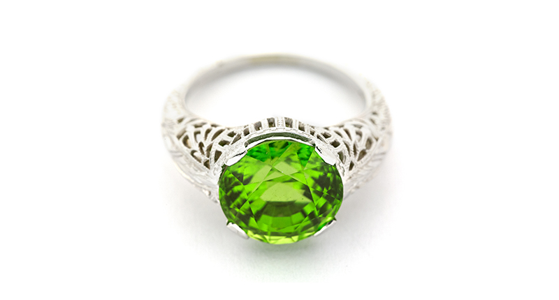 This ring from Bernard Nacht & Co. features a 6.72-carat round peridot in an 18-karat white gold setting with filigree and engraved details ($2,560).