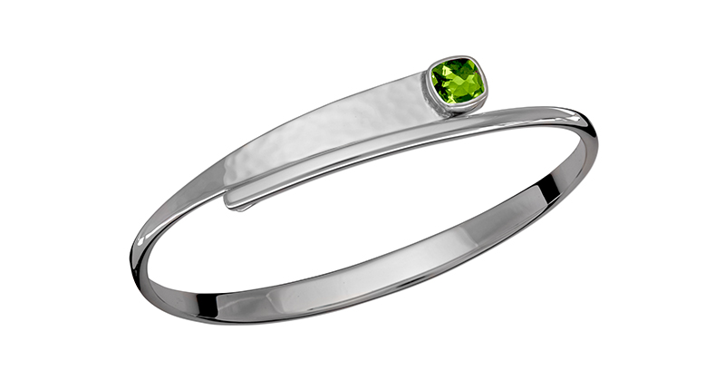 The “Checkerboard Swing” bracelet from Ed Levin Jewelry features an antique checkerboard cushion-cut peridot set in sterling silver ($429).