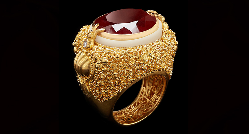 This ring from the collection features an oval-cut garnet, tagua seed and diamonds in 22-karat gold.