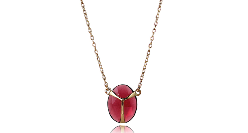 Rachel Atherley “Lucky Scarab” pendant in 18-karat gold with a rose-cut garnet ($575)<br /><a href="http://www.rachelatherley.com" target="_blank" rel="noopener noreferrer">RachelAtherley.com</a>