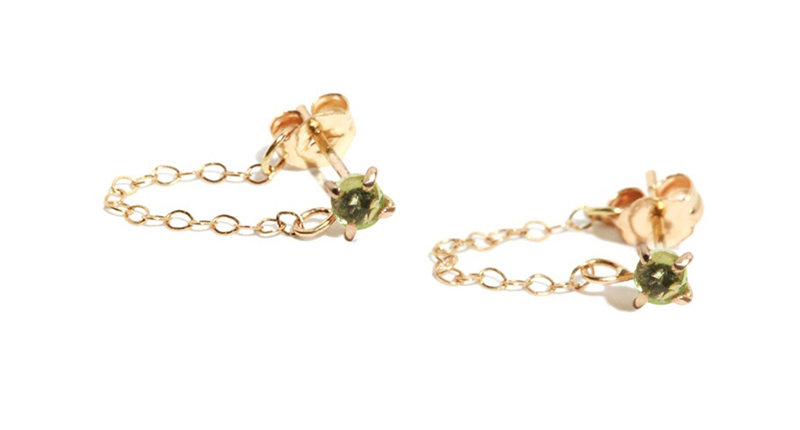 These are Melissa Joy Manning’s peridot post earrings in recycled 14-karat gold with a chain wrap ($300).