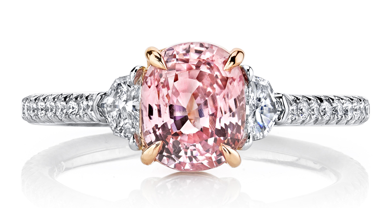 This Omi Privé style has a 2.02-carat oval padparadscha center stone, accented with 0.18 carats of epaulette-cut diamonds and 0.22 carats of brilliant round diamonds, set in platinum with 18-karat rose gold accents.  This Omi Privé style has a 2.02-carat oval padparadscha center stone, accented with 0.18 carats of epaulette-cut diamonds and 0.22 carats of brilliant round diamonds, set in platinum with 18-karat rose gold accents.