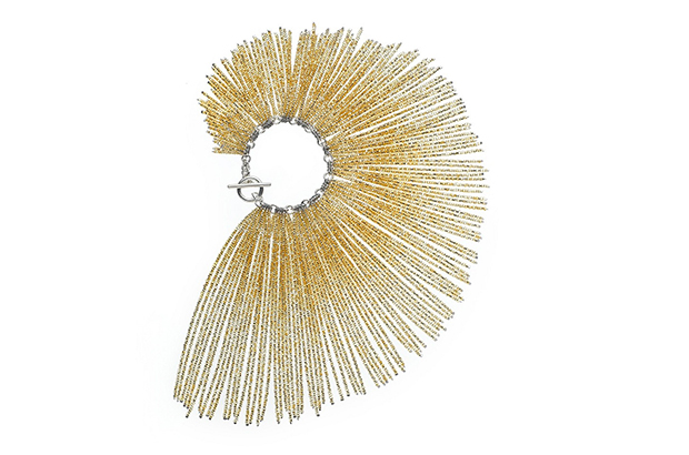 Michelle Pajak Reynolds’ “Helios” bracelet offers a handcrafted sterling silver chain and bar and toggle clasp with assorted gold-lined, clear crystal glass bead fringe ($1,125).<br />
<a href="http://michellepajakreynolds.com/" target="_blank"><span style="color: rgb(245, 255, 250);">michellepajakreynolds.com</span></a>