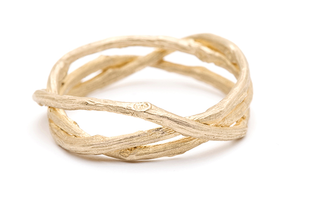 Three sinuous twig branches are woven in an asymmetric pattern, symbolizing unity and strength in this unconventional 14-karat gold band by Sofia Kaman ($850). <a href="https://www.sofiakaman.com/" target="_blank"><span style="color: rgb(255, 0, 0);">SofiaKaman.com</span></a>