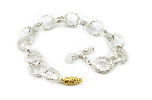 This sterling silver “Twig” bracelet features an 18-karat yellow gold bud that’s also available in 18-karat white or rose gold ($4,675).  This sterling silver “Twig” bracelet features an 18-karat yellow gold bud that’s also available in 18-karat white or rose gold ($4,675).