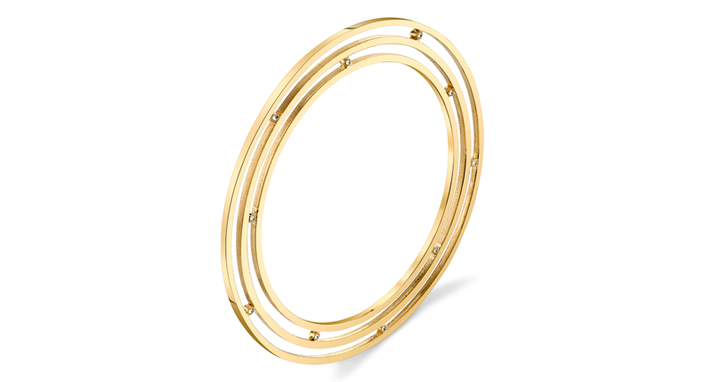 Karma El Khalil’s Saturn Ear Cuff in 18-karat yellow gold with diamonds, worn around the ear ($11,400) Karma El Khalil’s Saturn Ear Cuff in 18-karat yellow gold with diamonds, worn around the ear ($11,400)