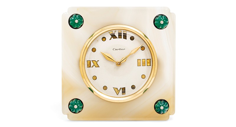 A circa 1940 retro Cartier desk clock made with carved chrysoprase beads, diamond and onyx accents and an agate case (estimated to sell for between $22,000 and $27,000)
