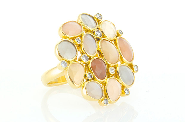 Huizenga’s “Hunka Bauble” ring with multi-colored moonstones and white diamonds made in 18-karat gold ($6,400). Huizenga’s “Hunka Bauble” ring with multi-colored moonstones and white diamonds made in 18-karat gold ($6,400).