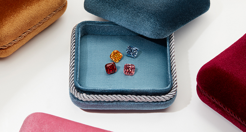 The four “hero” stones from Swarovski’s collection of colored lab-grown diamonds released earlier this year, clockwise from top right: “Gothic Cognac,” “Cubist Sky,” “Androgyny Flamingo,” and “Heavy Metal Cherry.” The company sells both colored and colorless lab-grown diamonds. (©Swarovski)