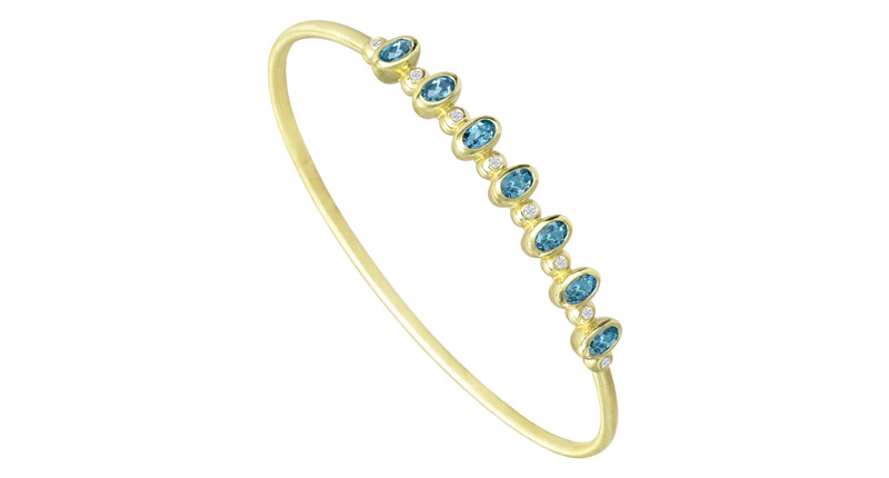 <strong>March: Aquamarine.</strong> Suzy Landa’s 18-karat gold bangle with 1.3 carats of aquamarine and diamond accents ($6,160)