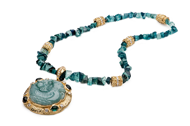 Briscoe’s indigo blue Tourmaline bead necklace features double 18-karat yellow gold “Laura” rondelles ($26,000 for necklace) and a carved jade “Duck” pendant with blue tourmaline and diamonds ($25,000 for pendant), set in 18-karat yellow gold. Briscoe’s indigo blue Tourmaline bead necklace features double 18-karat yellow gold “Laura” rondelles ($26,000 for necklace) and a carved jade “Duck” pendant with blue tourmaline and diamonds ($25,000 for pendant), set in 18-karat yellow gold.