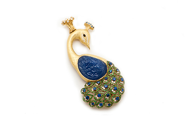Briscoe’s carved sapphire, tsavorite and diamond “Raj” peacock brooch in 18-karat yellow gold ($165,000) Briscoe’s carved sapphire, tsavorite and diamond “Raj” peacock brooch in 18-karat yellow gold ($165,000)