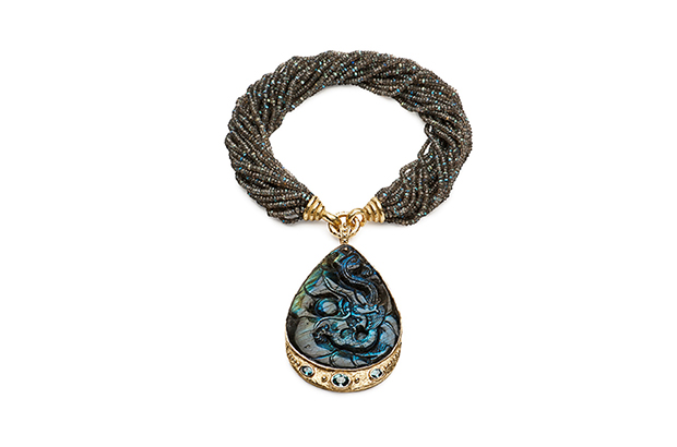 This carved labradorite pendant with a faceted oval blue zircon in 18-karat yellow gold ($26,000) hangs on a faceted labradorite bead necklace ($13,500). This carved labradorite pendant with a faceted oval blue zircon in 18-karat yellow gold ($26,000) hangs on a faceted labradorite bead necklace ($13,500).