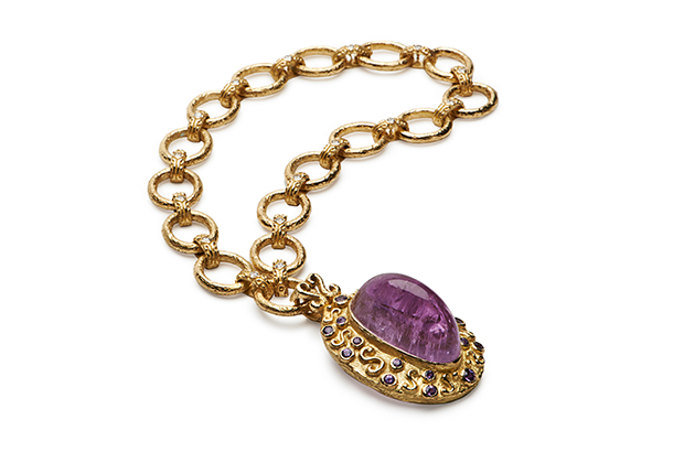 An 18-karat yellow gold and cabochon kunzite pendant accented with violet sapphires and diamonds ($16,000) hangs on two of Briscoe’s medium “Courtney’s Bridge” link bracelets hooked together as a necklace ($13,000 each), also in 18-karat yellow gold. An 18-karat yellow gold and cabochon kunzite pendant accented with violet sapphires and diamonds ($16,000) hangs on two of Briscoe’s medium “Courtney’s Bridge” link bracelets hooked together as a necklace ($13,000 each), also in 18-karat yellow gold.