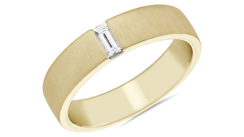 A 14-karat yellow gold band with a brushed finish and a north-west-set baguette diamond ($2,490)
