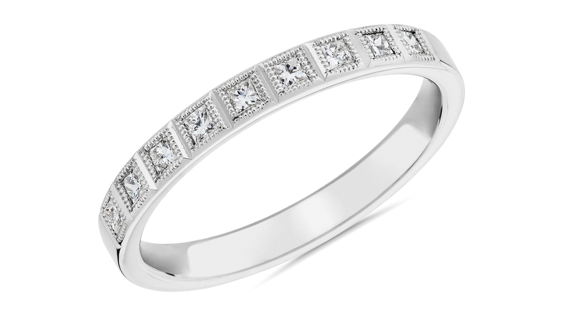 A 14-karat white gold ring from the Zac Posen collection, featuring princess diamonds and milgrain details ($990)