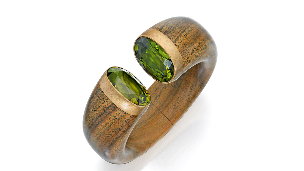 This cuff bracelet, set with peridot and tourmaline, sold for $60,4800. This cuff bracelet, set with peridot and tourmaline, sold for $60,4800.