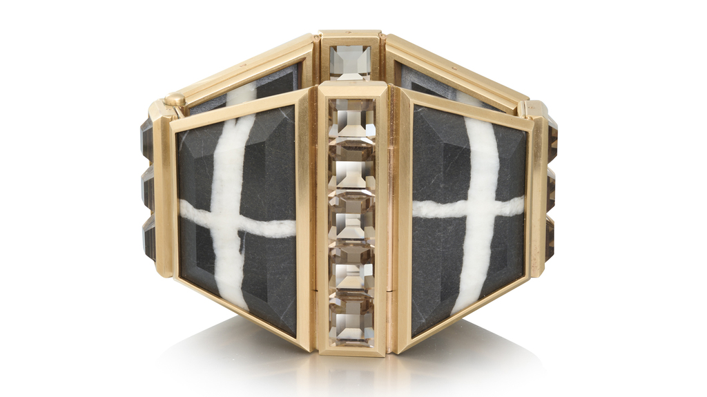 Cuff bracelet in bronze with gold hinges featuring pebbles and smoky quartz ($50,700) Cuff bracelet in bronze with gold hinges featuring pebbles and smoky quartz ($50,700)