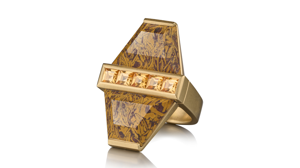 This “Double Pot Ring” features fossilized coral pots with mandarin garnets set in yellow gold ($16,900).