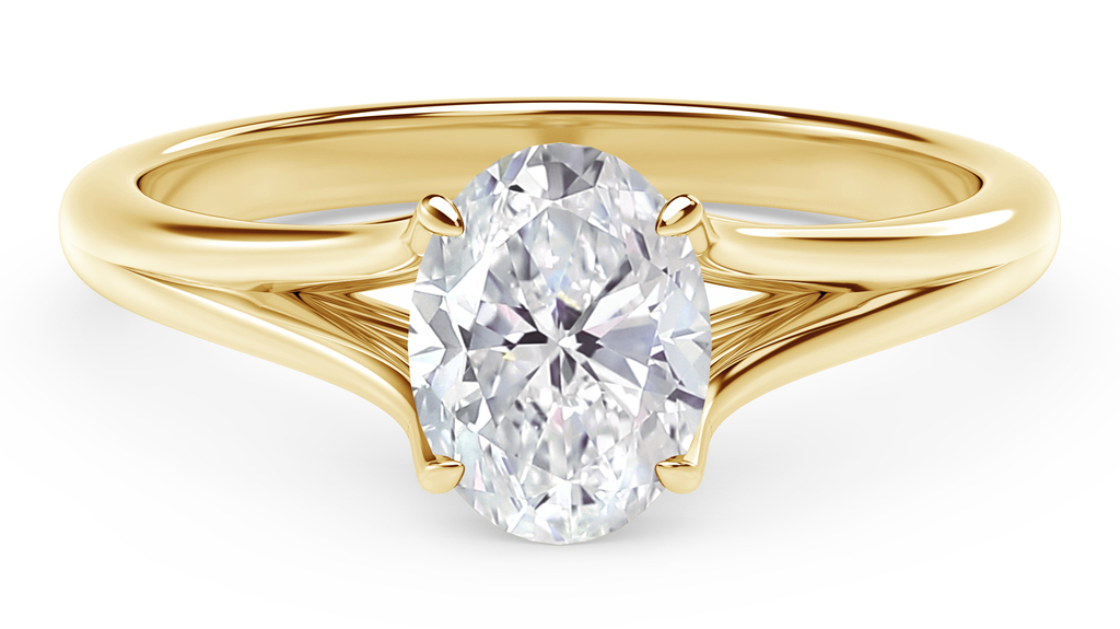 De Beers Forevermark “Unity” engagement ring in 18-karat yellow gold with an oval-shaped diamond (starting at $3,300)