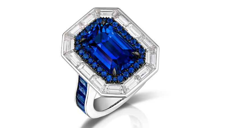 <b>Classical, First Place.</b> Gabriel Angulo of Pompos Jewelry Corporation’s platinum ring featuring a 6.29-carat blue Ceylon sapphire accented with 14 custom-cut baguette diamonds (2.27 total carats), 10 princess-cut sapphires (1.79 total carats), 30 round sapphires (0.44 total carats), and 58 round brilliant diamonds (0.29 total carats)