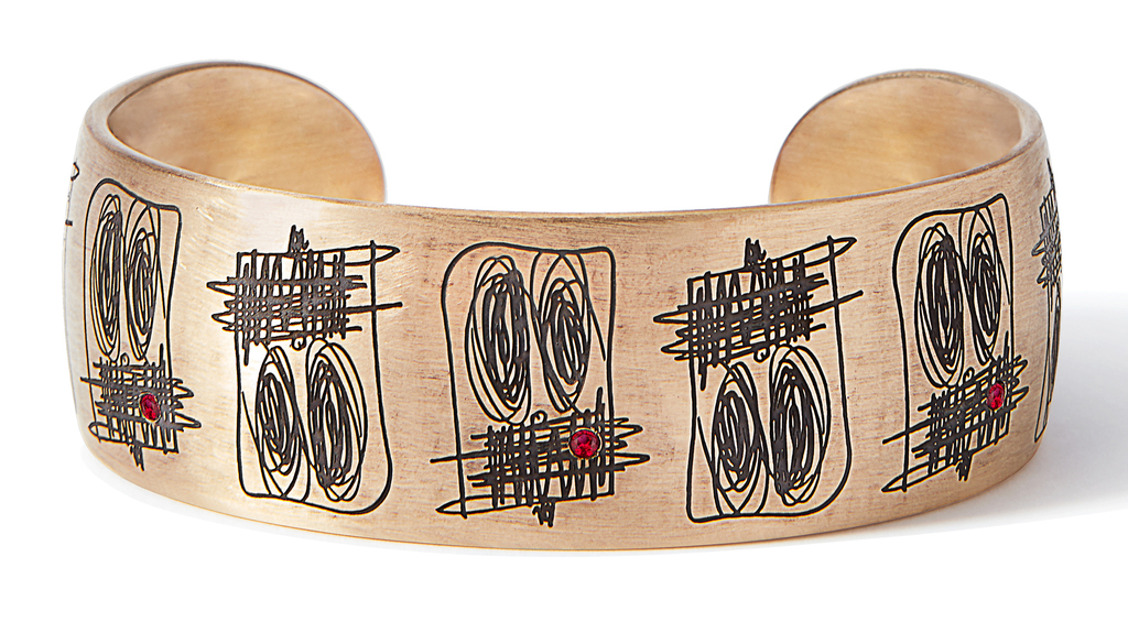 Rashid Johnson x LizWorks 9-karat gold cuff from “Anxious Men,” featuring rhodium engraving, red enamel, and five rubies weighing total 0.3 carats; edition of 15; $18,500. (Image courtesy of Sotheby’s) Rashid Johnson x LizWorks 9-karat gold cuff from “Anxious Men,” featuring rhodium engraving, red enamel, and five rubies weighing total 0.3 carats; edition of 15; $18,500. (Image courtesy of Sotheby’s)
