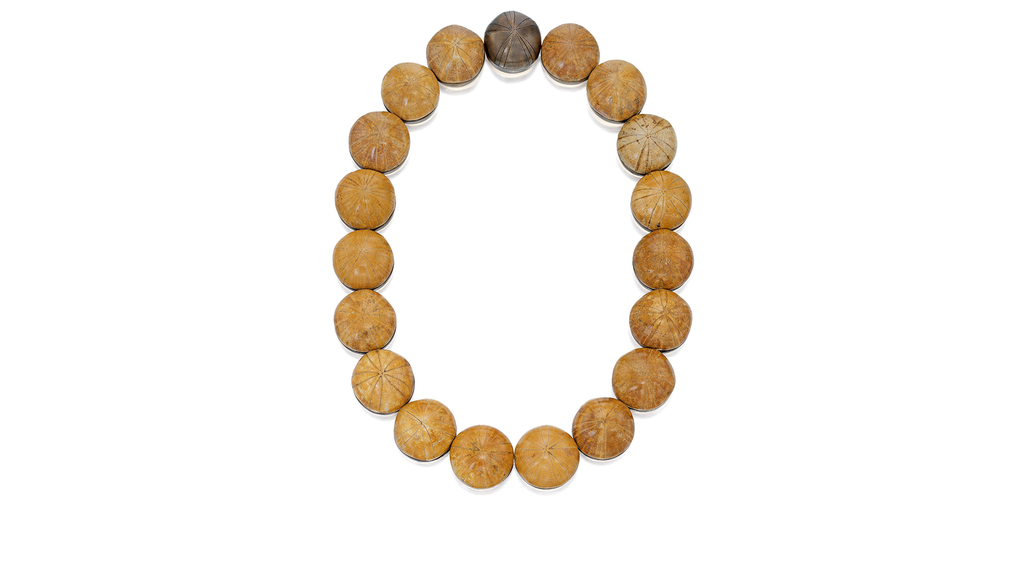 This necklace, featuring fossilized sea urchin, sold for $32,760. This necklace, featuring fossilized sea urchin, sold for $32,760.